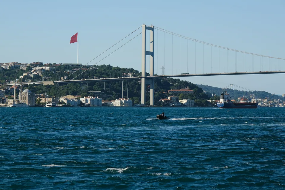 The Bosphorus Bridge across blue water in Istanbul