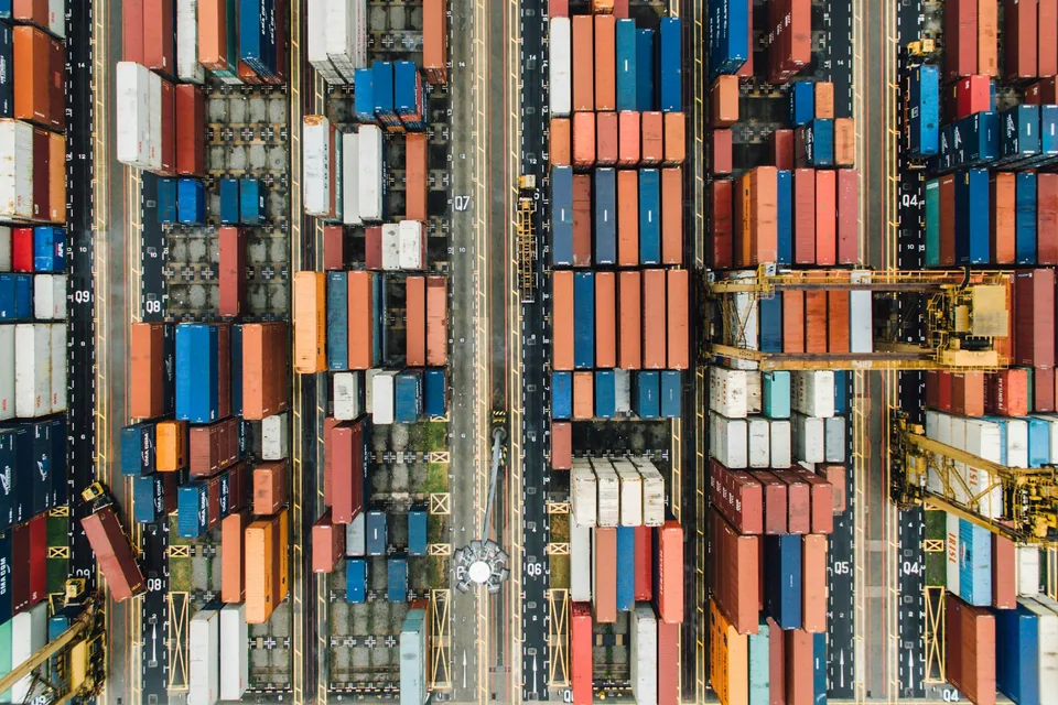 An aerial view of shipping containers in a port